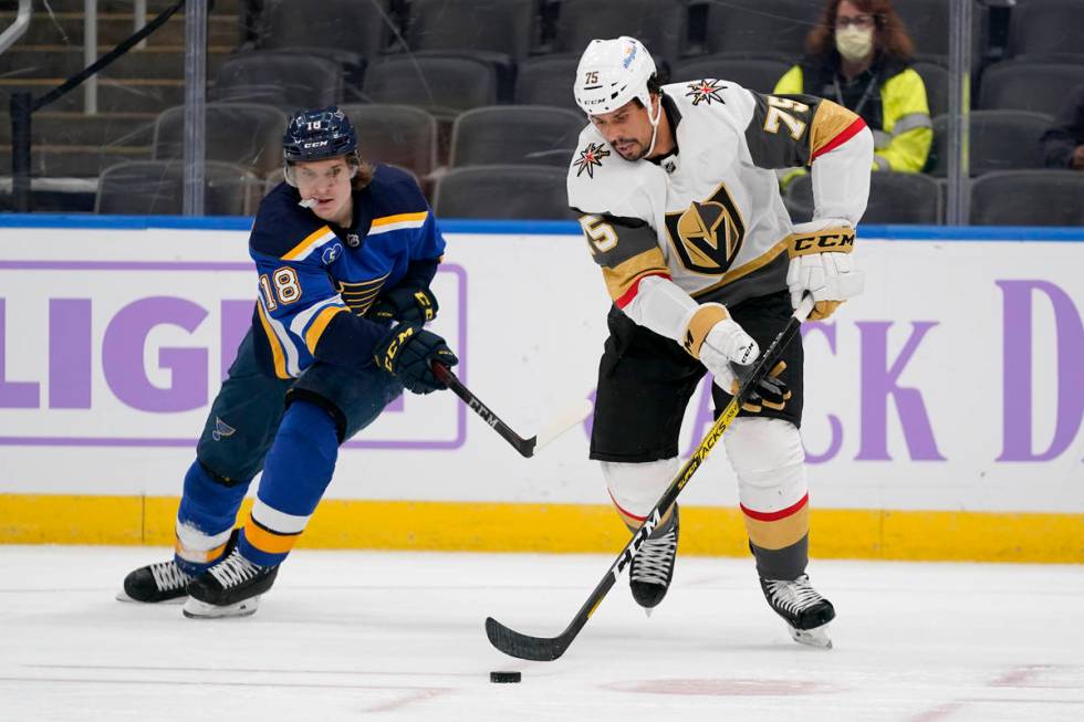 Vegas Golden Knights' Ryan Reaves (75) and St. Louis Blues' Robert Thomas (18) chase after a lo ...