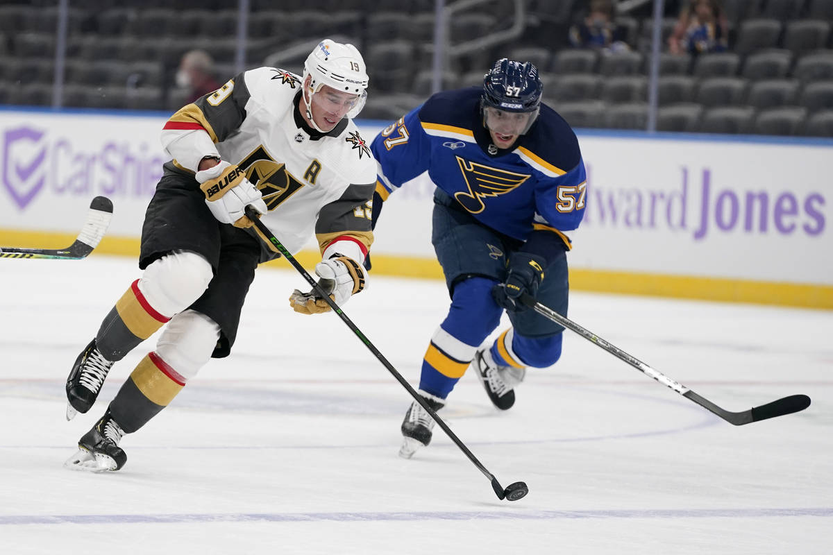 Vegas Golden Knights' Reilly Smith (19) brings the puck down the ice as St. Louis Blues' David ...