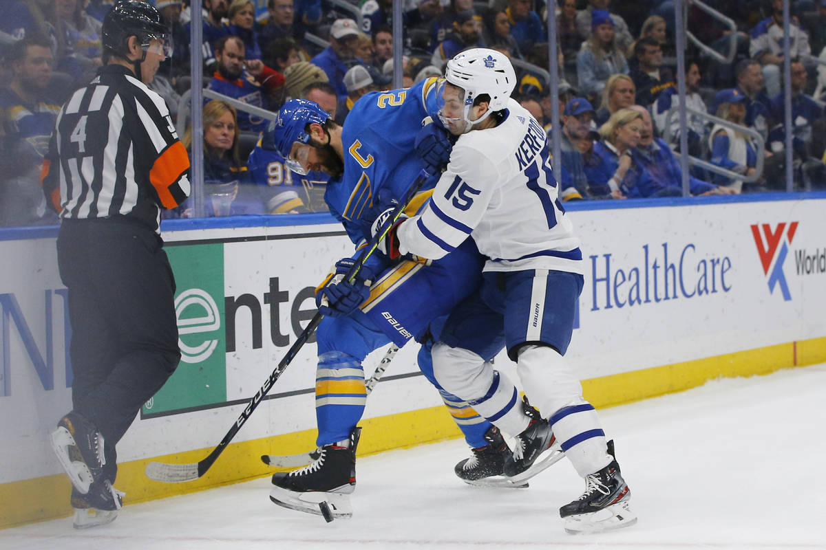 St. Louis Blues' Alex Pietrangelo is checked off the puck by Toronto Maple Leafs' Alexander Ker ...