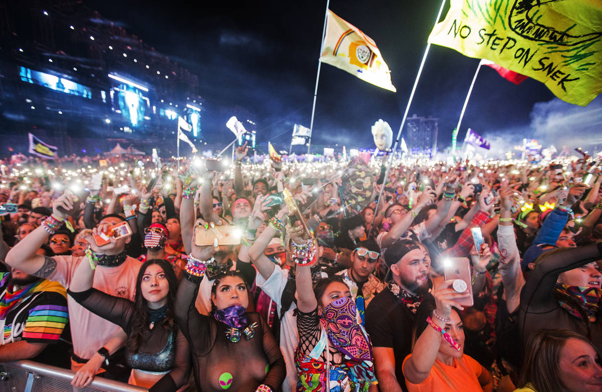 A sea of concertgoers dance during SAYMYNAME's performance at the Circuit Grounds stage on day ...