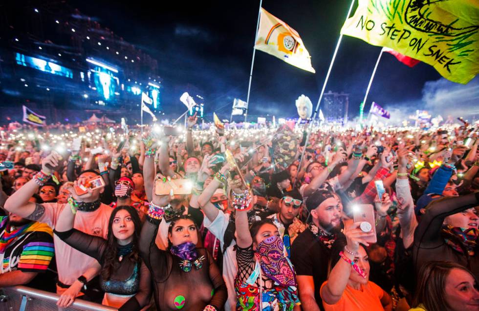 A sea of concertgoers dance during SAYMYNAME's performance at the Circuit Grounds stage on day ...