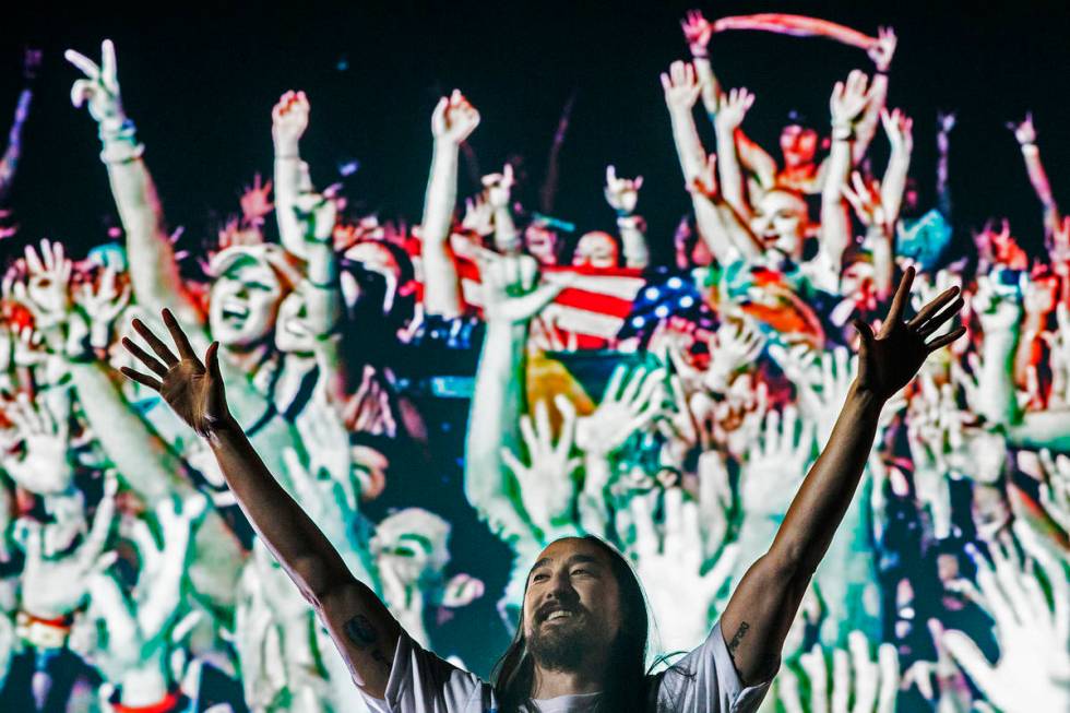 Steve Aoki pumps up the crowd during his performs at the Circuit Grounds stage on day three of ...