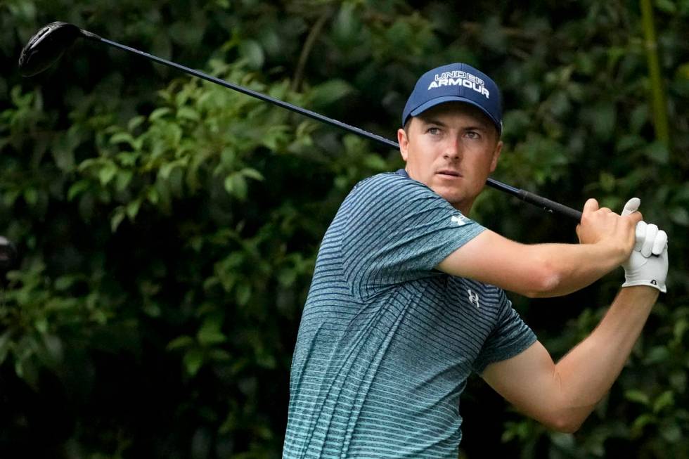 Jordan Spieth watches his drive on the 14th tee during the first round of the Masters golf tour ...