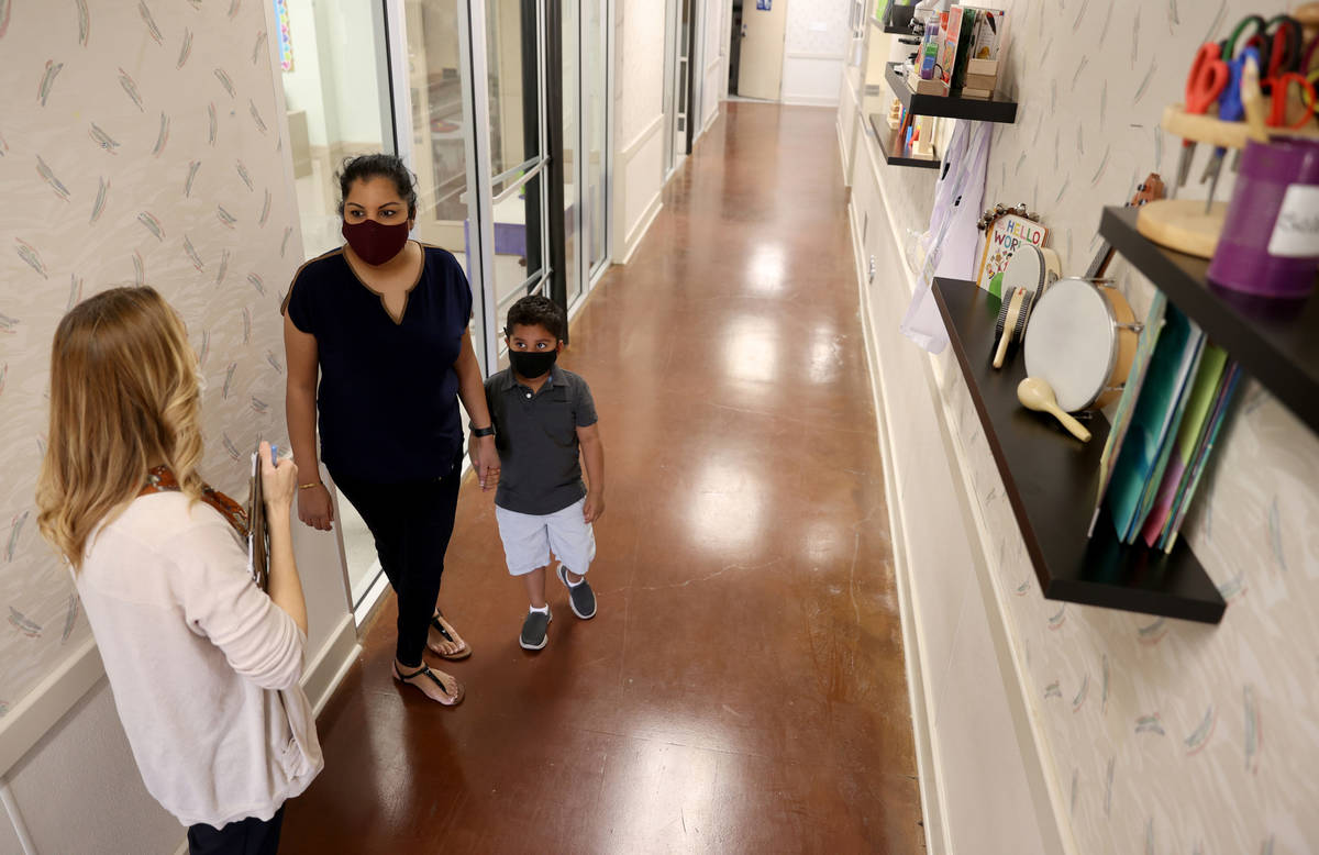 Preschool Director Tracy Kessler gives a tour to Nav Chohan and her son Aydin, 4, at Capstone C ...