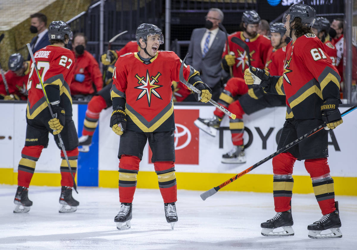 Golden Knights center Jonathan Marchessault (81) celebrates his goal with right wing Mark Stone ...