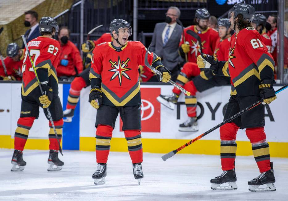 Golden Knights center Jonathan Marchessault (81) celebrates his goal with right wing Mark Stone ...