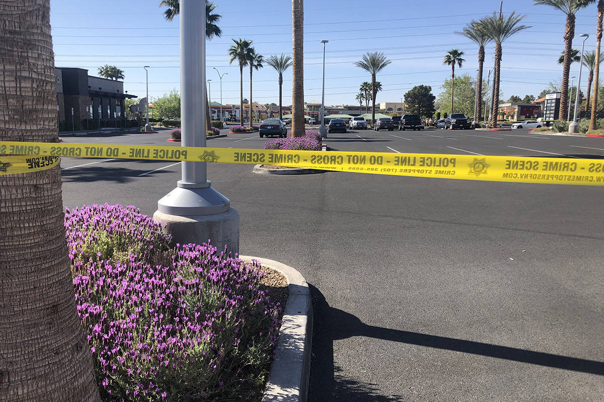 Police investigate a report of a body found Saturday, April 10, 2021, at West Charleston Boulev ...