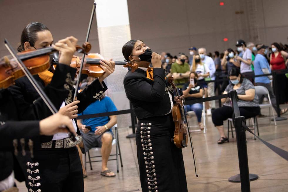 Cristina Lopez, center, sings as part of Mariachi Nuestras Raices during their performace at th ...