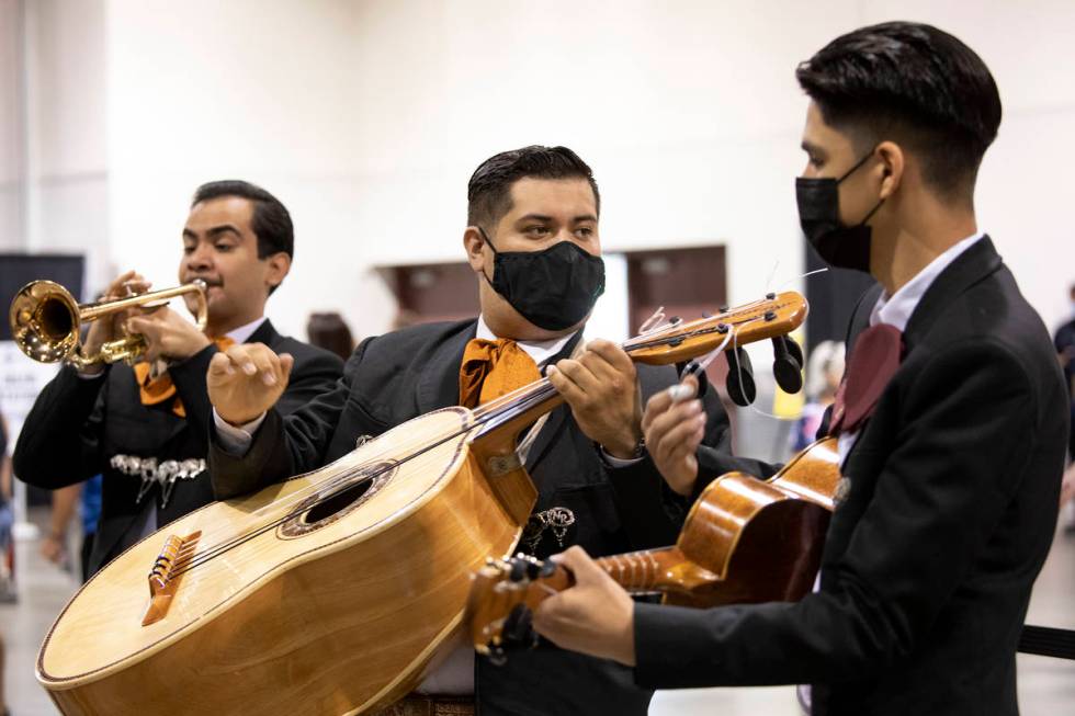 Andres Villalobos, Armulfo Reyna and Ceasar Arciga perform as part of Mariachi Nuestras Raices ...