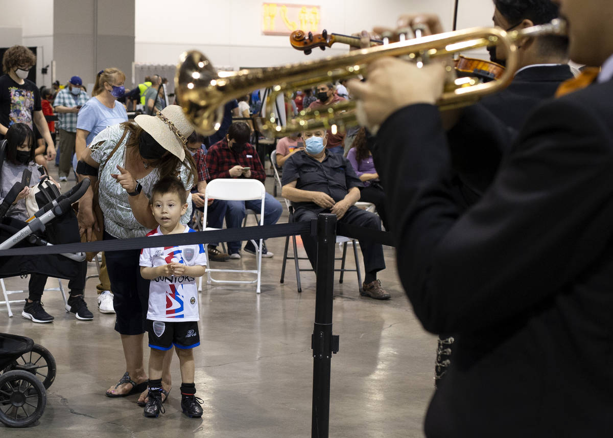 Iker Vasquez, 4, and his grandmother Irma Valdivieso watch Mariachi Nuestras Raices's performan ...