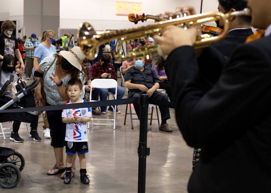 Iker Vasquez, 4, and his grandmother Irma Valdivieso watch Mariachi Nuestras Raices's performan ...