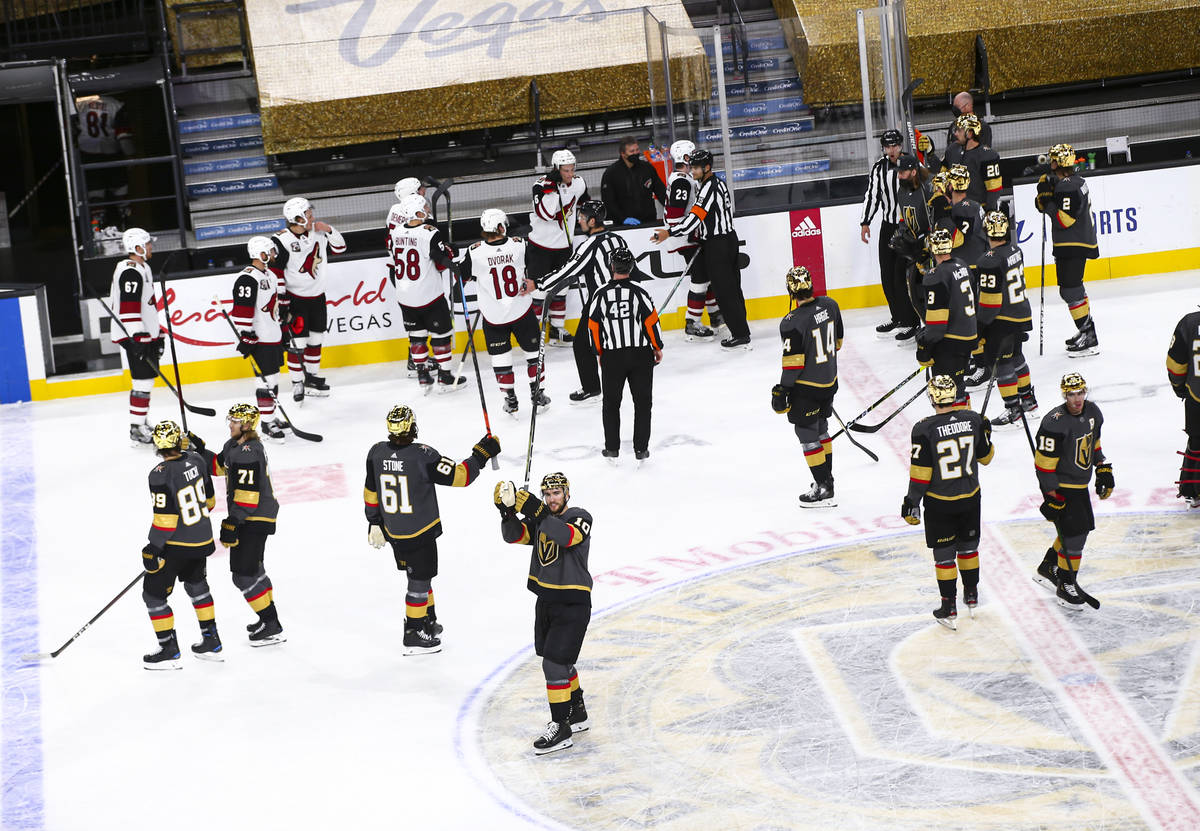 The Golden Knights celebrate after a shutout win over the Arizona Coyotes in an NHL hockey game ...