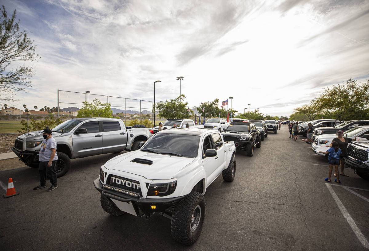 Members of Sin City Tundras wait to start a vehicle parade to support 9-year-old Aaliyah Velasq ...