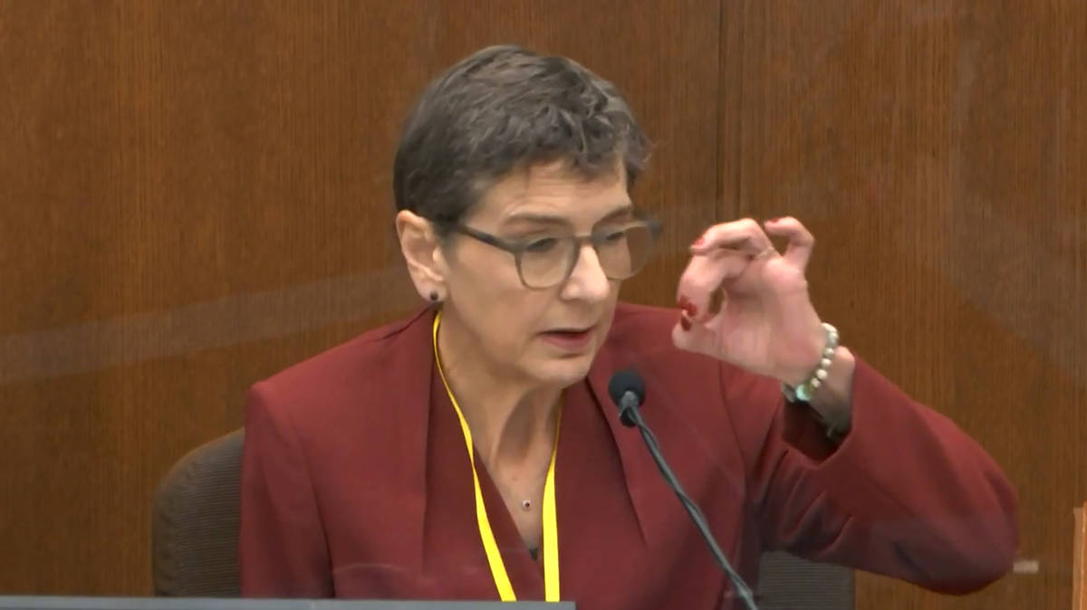 In this image from video, Dr. Lindsey Thomas, a forensic pathologist, now retired, testifies as ...