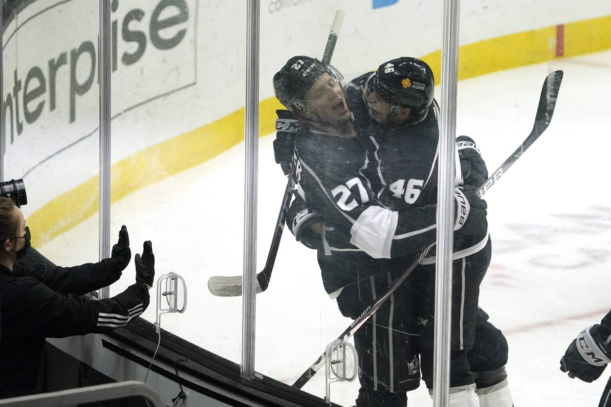 Los Angeles Kings left wing Austin Wagner, left, celebrates his goal with center Blake Lizotte ...