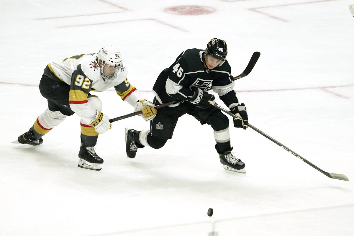 Vegas Golden Knights left wing Tomas Nosek, left, and Los Angeles Kings center Blake Lizotte ba ...