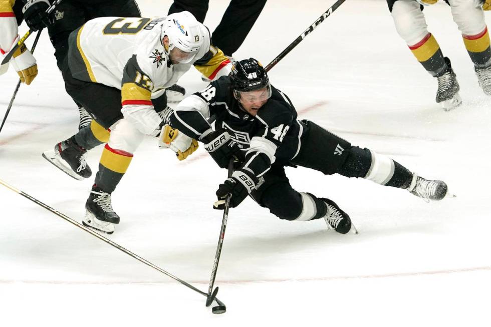 Los Angeles Kings left wing Brendan Lemieux, right, falls while under pressure from Vegas Golde ...