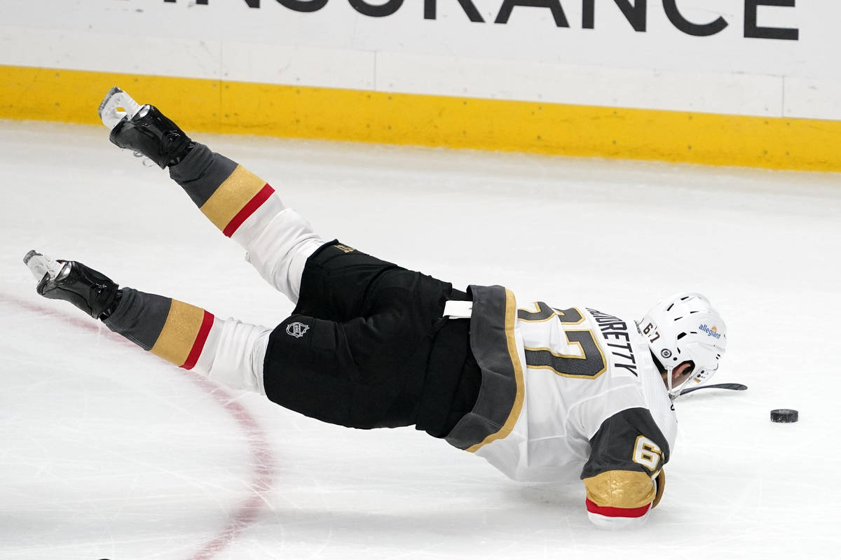 Vegas Golden Knights left wing Max Pacioretty trips as he moves the puck during the third perio ...