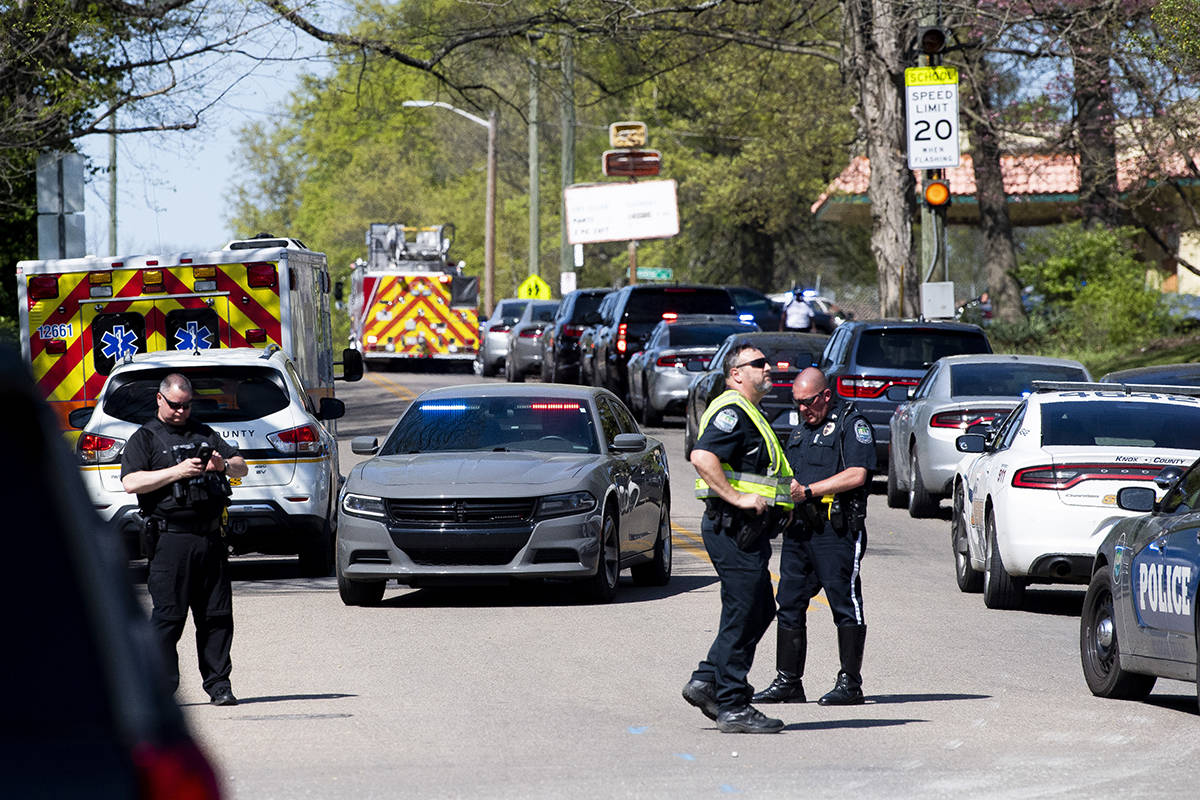 Police work in the area of Austin-East Magnet High School after a reported shooting Monday, Apr ...