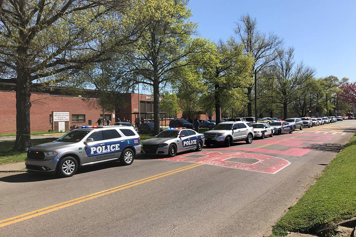 Police work in the area of Austin-East Magnet High School after a reported shooting Monday, Apr ...