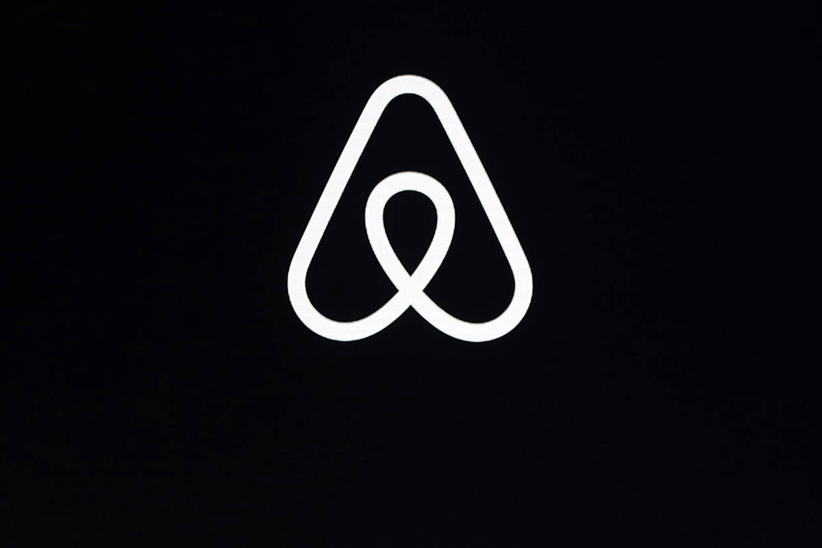 FILE - This Feb. 22, 2018, file photo shows an Airbnb logo during an event in San Francisco. (A ...