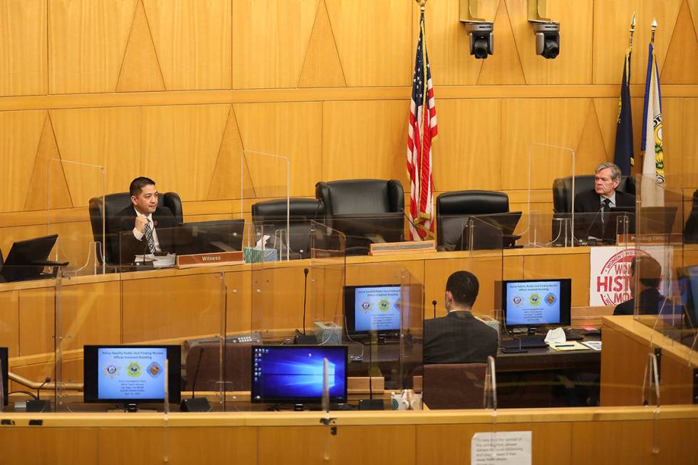 In this file photo, Las Vegas police Detective Scott Mendoza, left, speaks during a March fact- ...