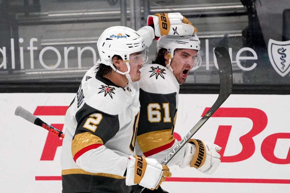 Vegas Golden Knights right wing Mark Stone, right, celebrates his goal with defenseman Zach Whi ...