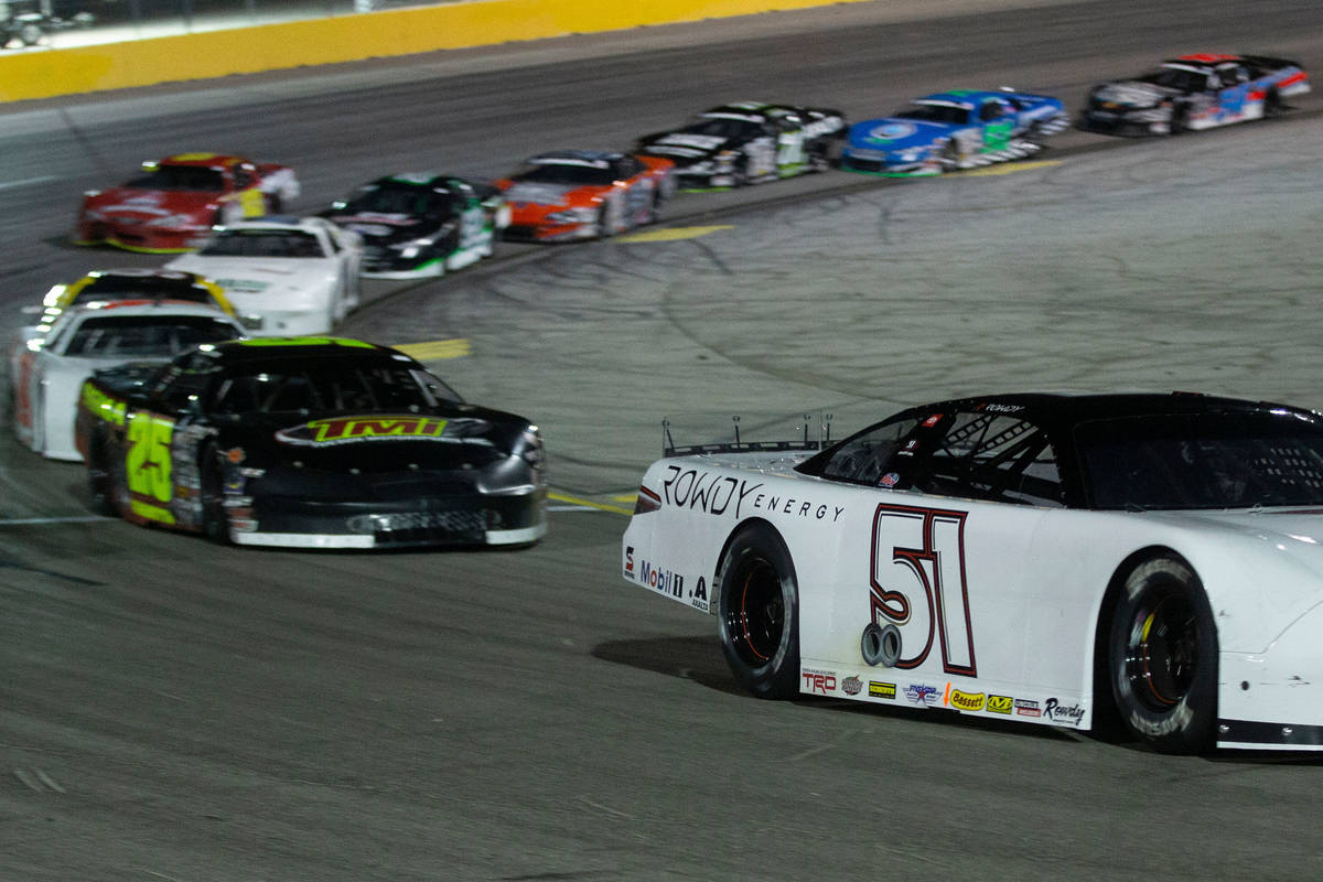 NASCAR star Kyle Busch turns the corner during the Star Nursery 100 Super Late Model feature ra ...