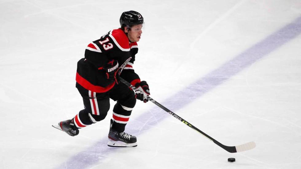 Chicago Blackhawks center Mattias Janmark (13) shoots the puck against the Dallas Stars during ...