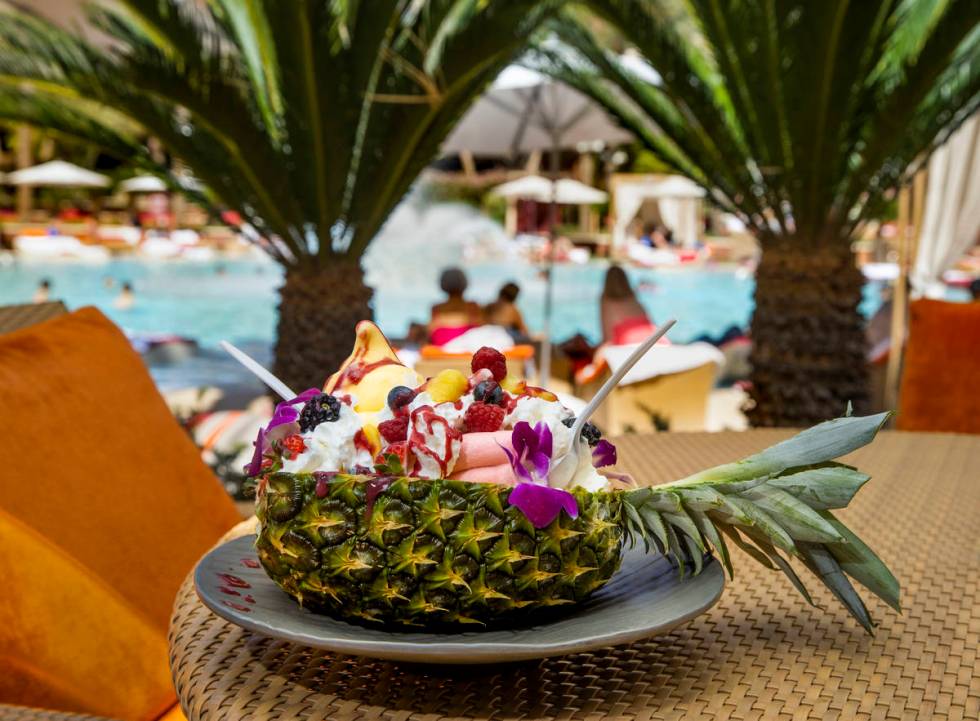 The Mega Dole Whip Sundae offered poolside has mango and strawberry Dole Whip, topped with frui ...