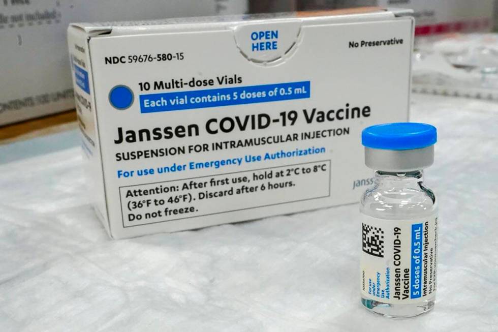 In this Thursday, April 8, 2021, file photo, the Johnson & Johnson COVID-19 vaccine sits on a t ...