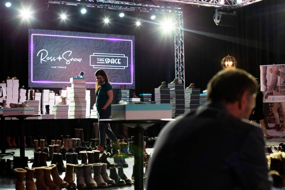 Shoppers browse at Vegas-based footwear brand Ross & Snow's pop-up sale at The Space on Wed ...