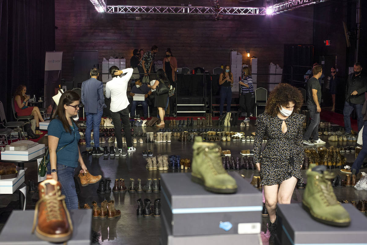 Shoppers browse at Vegas-based footwear brand Ross & Snow's pop-up sale at The Space on Wed ...