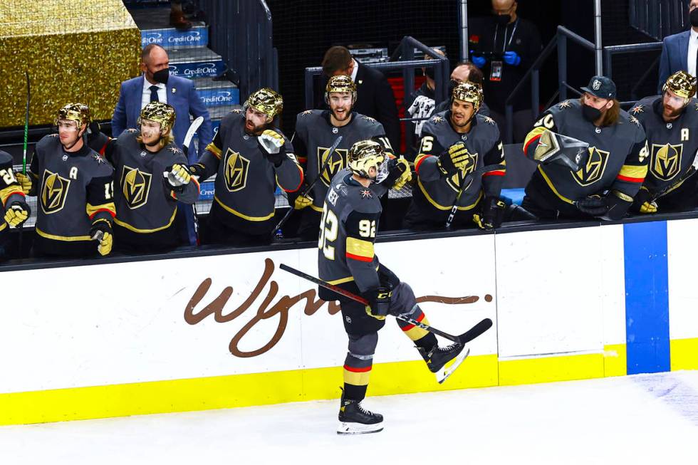 Golden Knights' Tomas Nosek (92) celebrates with teammates after scoring against the Arizona Co ...