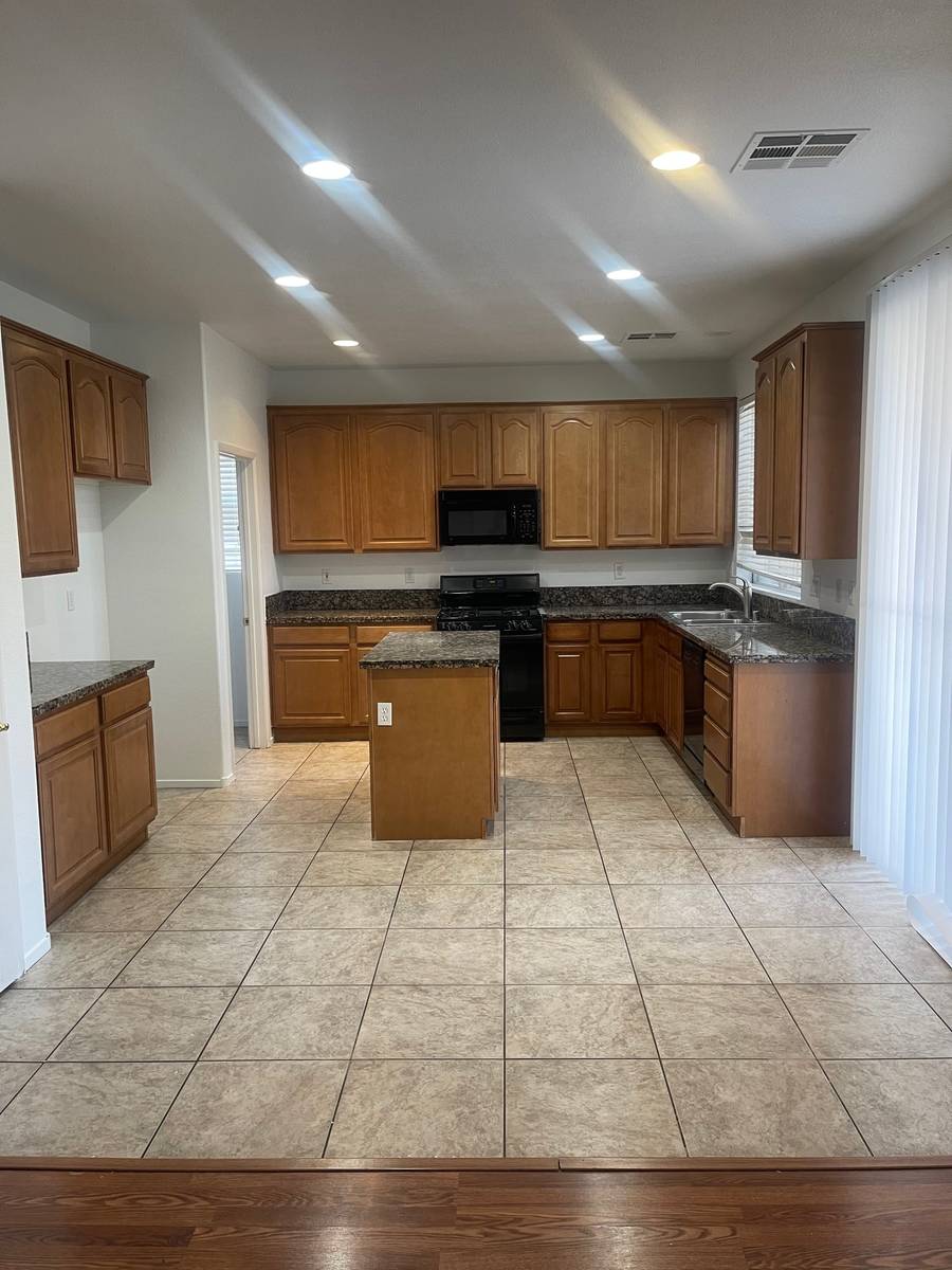 The kitchen of 5720 Deer Brush Court, North Las Vegas includes an island and plenty of space to ...