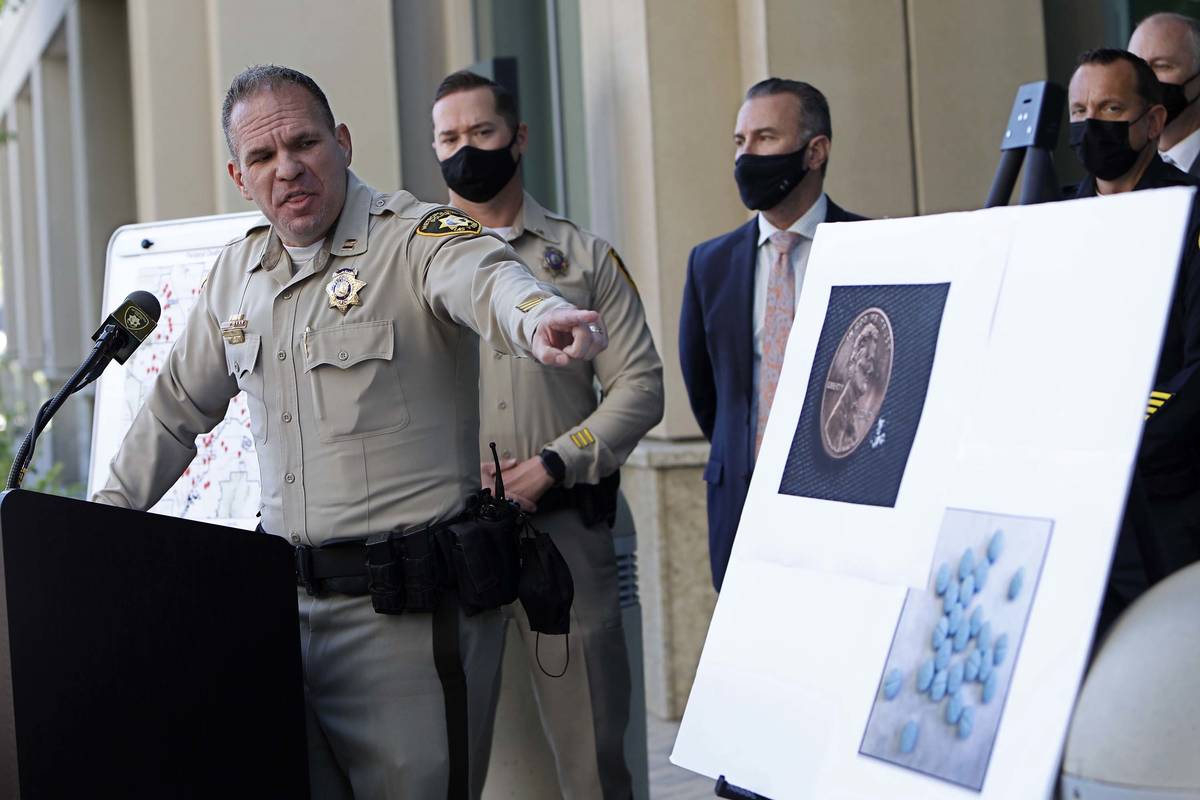 Metropolitan Police Department Narcotics Crimes Bureau Capt. John Pelletier, left, speaks durin ...