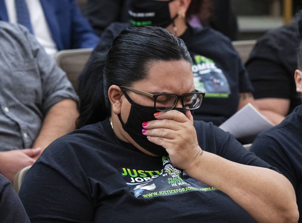Sulay Lugo cries as she listens to testimony during a public review of the fatal police shootin ...