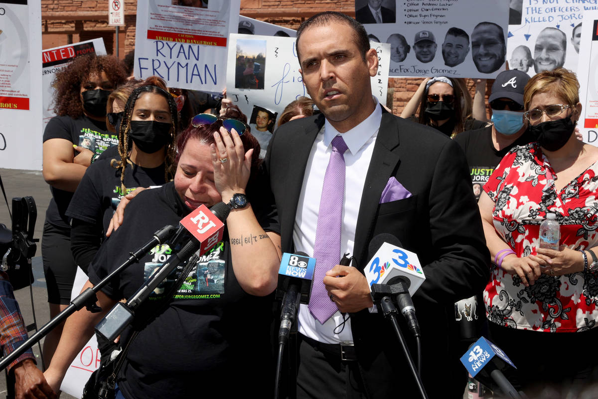 Attorney Rodolfo Gonzalez stands alongside Jeanne Llera, mother of Jorge Gomez, a Black Lives M ...