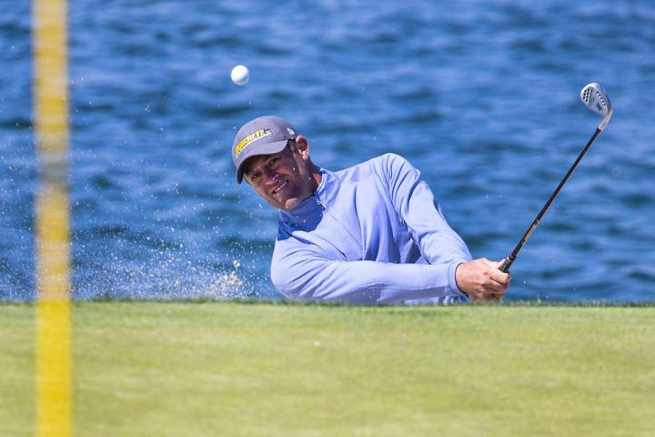 Jamie Arnold of Sydney, Australia, hits out of a bunker on the fourth hole during the first ro ...