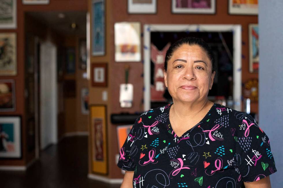 Irma Nuñez a personal care aid, at her client's home on Wednesday, April 14, 2021, in Las Vega ...