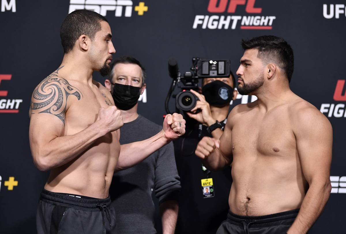 Opponents Robert Whittaker of Australia (left) and Kelvin Gastelum face off during the UFC weig ...