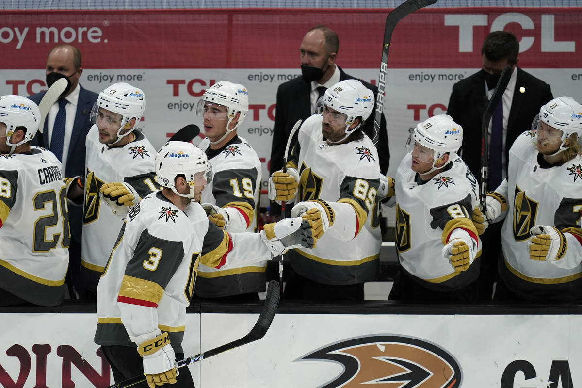 Vegas Golden Knights defenseman Brayden McNabb (3) celebrates with teammates after he scored a ...