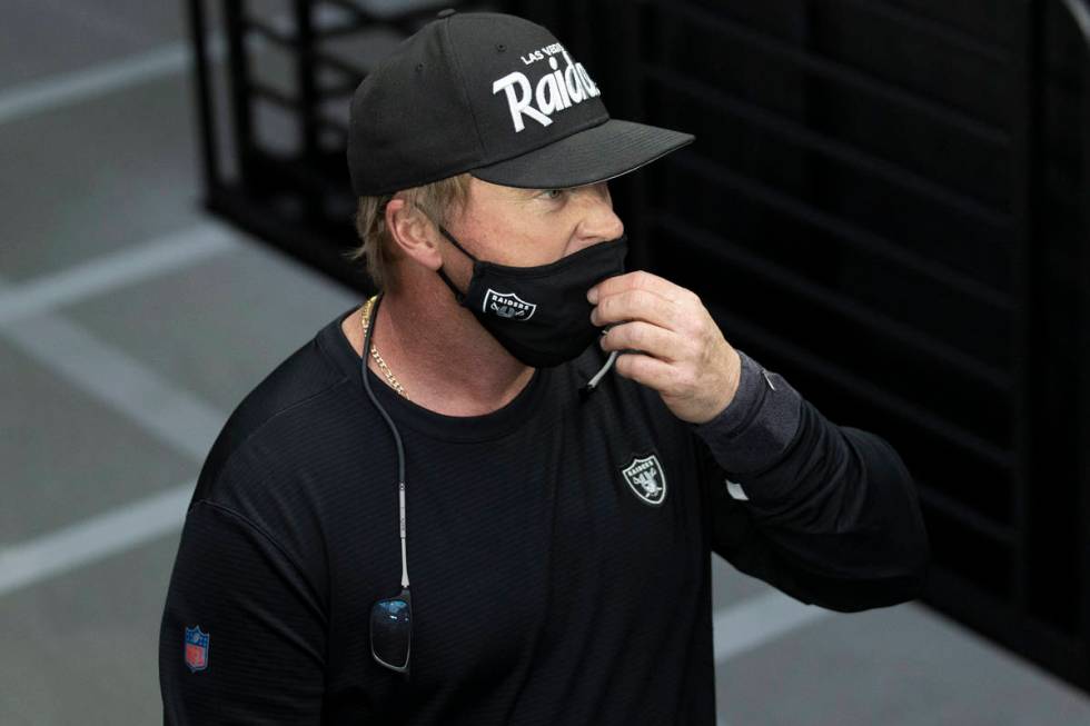 Raiders head coach Jon Gruden takes the field during warm ups before the start of an NFL footba ...