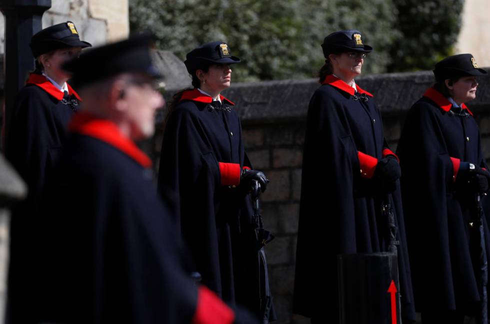 Wardens and armed police guard the Henry VIII gate in Windsor, England, Friday, April 16, 2021. ...