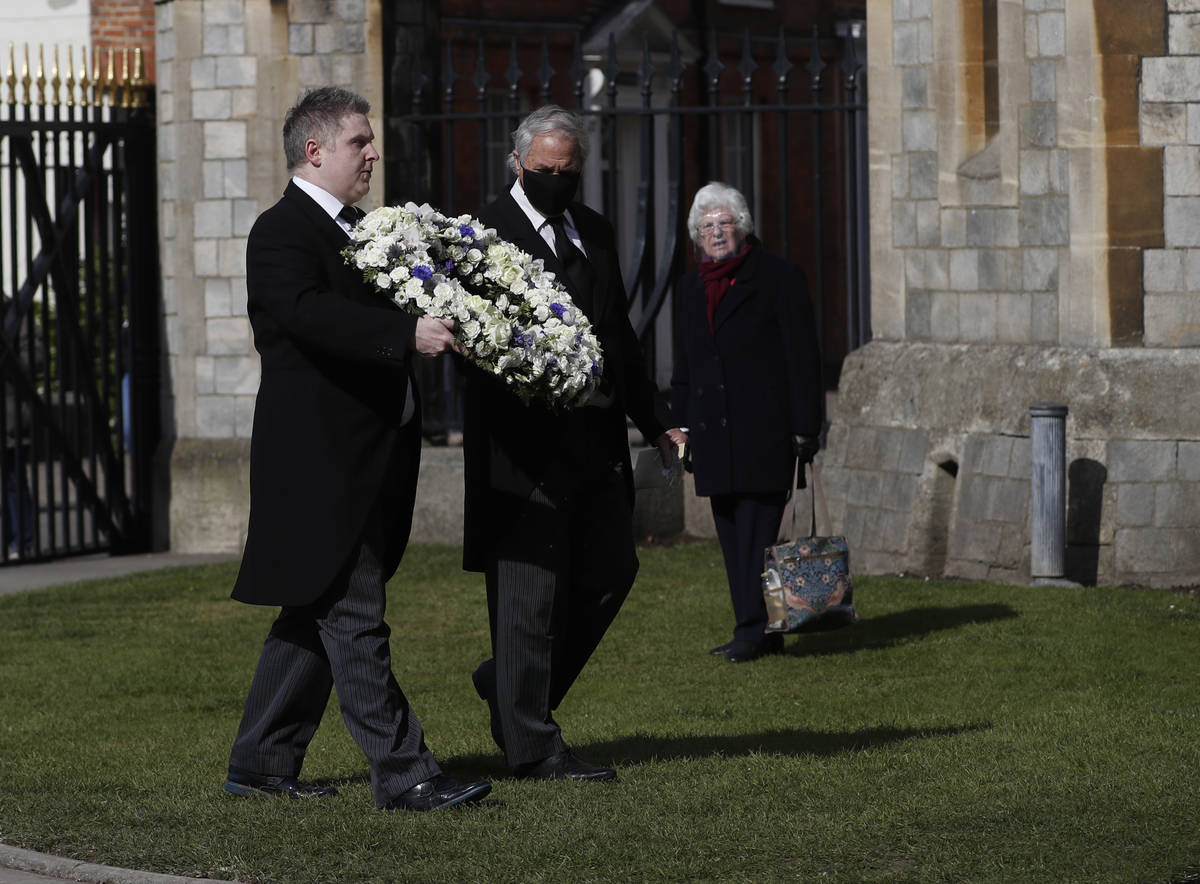 Andre and Stan Walker lay a floral wreath for Prince Philip outside Windsor Castle in Windsor, ...