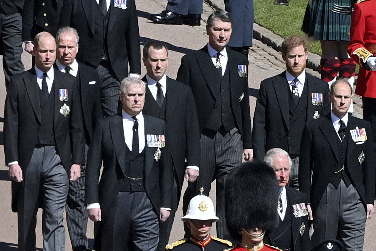 Prince William, left, and Prince Harry, 2nd right, walk with family members following the coffi ...