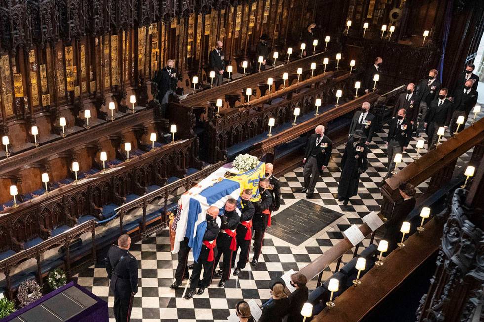 Pallbearers carry the coffin of the Duke of Edinburgh during his funeral, at St George's Chapel ...