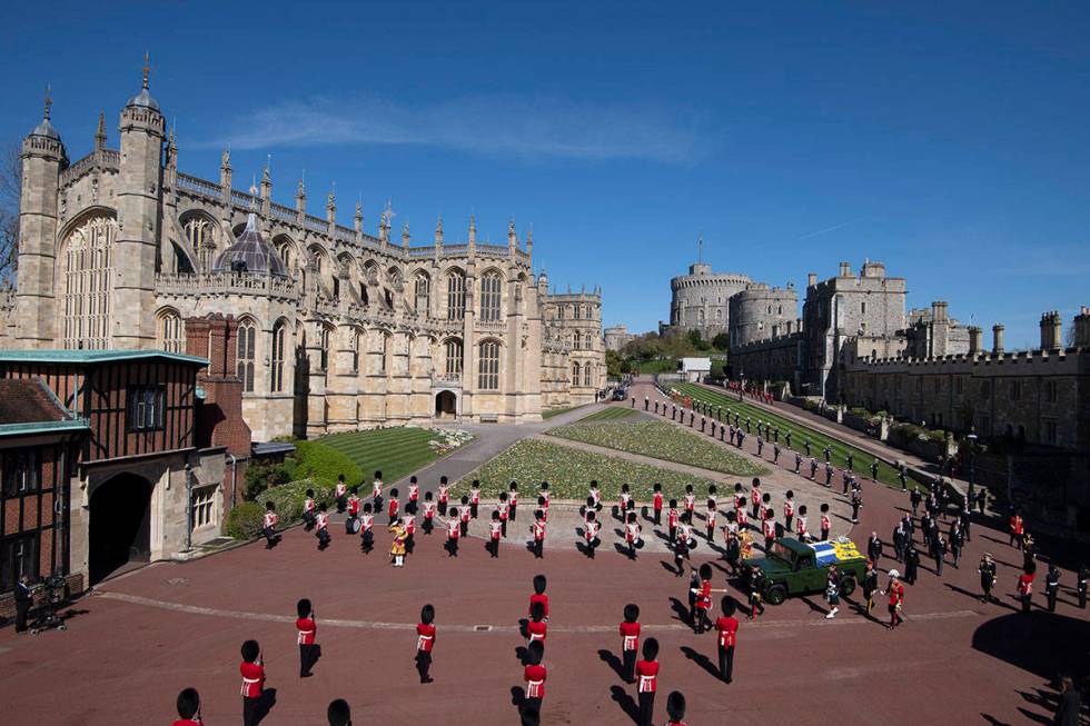 Family members follow the coffin during a procession arriving at St George's Chapel for the fun ...