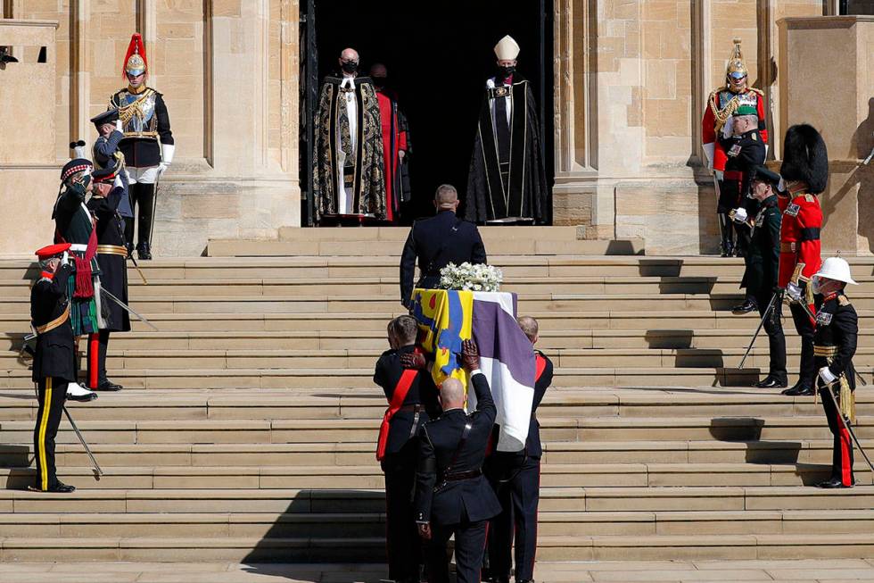 The coffin is carried inside the St George's Chapel for the funeral of Britain's Prince Philip ...