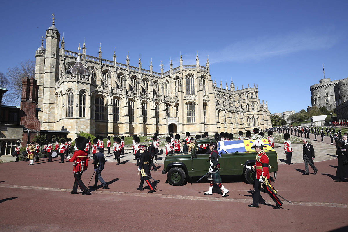 The coffin slowly makes its way in a ceremonial procession during the funeral of Britain's Prin ...